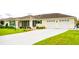 Charming single-story home with a well-manicured lawn, two-car garage, and screened-in porch at 6190 Sw 84Th Pl, Ocala, FL 34476