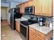 Bright kitchen with stainless steel appliances, granite countertops, and tiled backsplash at 6190 Sw 84Th Pl, Ocala, FL 34476