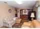 Relaxing living room area with large sectional sofa, flat screen tv, and built-in bookshelves at 6190 Sw 84Th Pl, Ocala, FL 34476