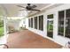 Covered patio with ceiling fan, ideal for outdoor relaxation and entertaining at 6190 Sw 84Th Pl, Ocala, FL 34476