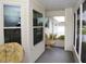 Inviting screened front porch with comfortable seating and views of the landscaped front yard at 6190 Sw 84Th Pl, Ocala, FL 34476