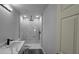 Modern bathroom with a single sink vanity and a stylish, marble-tiled shower at 717 Marion Oaks Mnr, Ocala, FL 34473