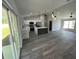 Bright, open-concept kitchen and living space with modern finishes and lots of natural light at 717 Marion Oaks Mnr, Ocala, FL 34473