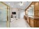 Primary bathroom featuring a large soaking tub, vanity, and a walk-in shower at 7915 Se 12Th Cir, Ocala, FL 34480