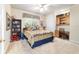 Bedroom with a decorative bed, desk, and bookshelf at 7915 Se 12Th Cir, Ocala, FL 34480