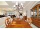 Elegant dining room with chandelier lighting at 7915 Se 12Th Cir, Ocala, FL 34480
