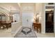 Inviting foyer with an elegant rug, a view into the dining room and easy access to theater at 7915 Se 12Th Cir, Ocala, FL 34480