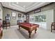 Recreation room with a pool table and access to an outdoor pool area at 7915 Se 12Th Cir, Ocala, FL 34480