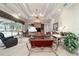 Bright living room with large windows providing a view of the pool and outdoor space at 7915 Se 12Th Cir, Ocala, FL 34480
