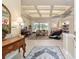 Bright living room featuring a tray ceiling, fireplace, and tiled floors at 7915 Se 12Th Cir, Ocala, FL 34480