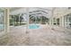 Large tiled outdoor pool area with plenty of room for entertaining and lounging at 7915 Se 12Th Cir, Ocala, FL 34480