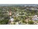 A scenic aerial view of a neighborhood with lush trees and well-maintained houses at 828 Se 3Rd St, Ocala, FL 34471