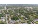 A wide aerial shot of a community showcasing mature landscaping, homes, and community spaces at 828 Se 3Rd St, Ocala, FL 34471