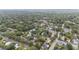A scenic aerial view of a neighborhood with lush trees and well-maintained houses at 828 Se 3Rd St, Ocala, FL 34471