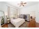 Bright bedroom with hardwood floors, large windows, and ample closet space at 828 Se 3Rd St, Ocala, FL 34471