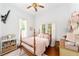 This bedroom has a cozy atmosphere with a four-poster bed, and plenty of natural light at 828 Se 3Rd St, Ocala, FL 34471