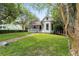 Charming home with a well-manicured lawn, brick walkway, and inviting porch, perfect for a relaxing lifestyle at 828 Se 3Rd St, Ocala, FL 34471