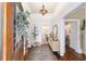 Inviting foyer with hardwood floors, decorative lighting, and elegant accents at 828 Se 3Rd St, Ocala, FL 34471