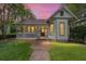 Charming home with a welcoming front porch and a brick path leading to the entrance at 828 Se 3Rd St, Ocala, FL 34471
