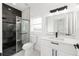 Modern bathroom featuring a glass shower with black marble and a sleek vanity at 8456 Se 164Th Pl, Summerfield, FL 34491