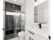Modern bathroom featuring black fixtures, granite countertops and a sleek glass shower at 8456 Se 164Th Pl, Summerfield, FL 34491
