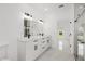 Bright bathroom with double vanity, modern lighting, and sleek fixtures and glass shower at 8456 Se 164Th Pl, Summerfield, FL 34491