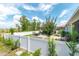 Beautifully landscaped backyard features a patio with gazebo and seating area and is surrounded by a white vinyl fence at 9886 Sw 104Th Ave, Ocala, FL 34481