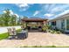 Outdoor patio with gazebo, lush landscaping, outdoor furniture, and a beautiful blue sky at 9886 Sw 104Th Ave, Ocala, FL 34481