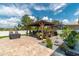 Beautiful backyard featuring a gazebo with a seating area, landscaped garden, and paved patio perfect for outdoor relaxation at 9886 Sw 104Th Ave, Ocala, FL 34481