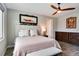 Comfortable bedroom featuring a ceiling fan, a decorative wall painting, and a decorative headboard at 9886 Sw 104Th Ave, Ocala, FL 34481