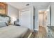 Cozy bedroom with wood-look floors, closet and attached bathroom at 9886 Sw 104Th Ave, Ocala, FL 34481