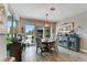 Bright dining area with wood floors and backyard views at 9886 Sw 104Th Ave, Ocala, FL 34481