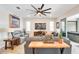 Cozy living room features comfortable seating, fireplace, and a modern ceiling fan at 9886 Sw 104Th Ave, Ocala, FL 34481