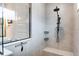Modern bathroom featuring a shower with a black showerhead and a clear glass enclosure at 9886 Sw 104Th Ave, Ocala, FL 34481