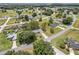 Aerial view of the neighborhood, showcasing the house's location amidst lush greenery and other well-kept homes at 106 Pine Trce, Ocala, FL 34472