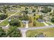 An aerial view of the property shows a well-maintained home with a long driveway in a quiet neighborhood at 106 Pine Trce, Ocala, FL 34472