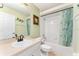 Bathroom featuring shower-tub combo, vanity, and nautical decor at 106 Pine Trce, Ocala, FL 34472