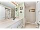 The bathroom features white cabinetry and a shower/tub combo at 106 Pine Trce, Ocala, FL 34472