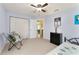 Cozy bedroom with ample storage featuring carpet flooring, ceiling fan, and soft lighting at 106 Pine Trce, Ocala, FL 34472