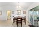 Dining area with tile flooring and sliding glass doors leading to the lanai, great for indoor-outdoor living at 106 Pine Trce, Ocala, FL 34472