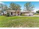 Charming single-story home featuring a well-maintained lawn and inviting curb appeal at 106 Pine Trce, Ocala, FL 34472