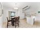 Kitchen with tile floor, white cabinets, and a dining table at 106 Pine Trce, Ocala, FL 34472