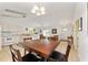 Open-concept kitchen with dining area and view into the living room, perfect for entertaining at 106 Pine Trce, Ocala, FL 34472