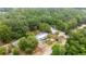 Aerial view of the property in a treed lot at 10671 Ne 152Nd Ln, Fort Mc Coy, FL 32134