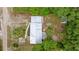 Birds-eye view of home, landscaped yard, and roof at 10671 Ne 152Nd Ln, Fort Mc Coy, FL 32134