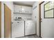 Functional laundry area featuring a washer and dryer with exterior access at 10671 Ne 152Nd Ln, Fort Mc Coy, FL 32134