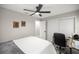 Bedroom features a bed, desk, chair and a closet for storage at 11326 Se 175Th Pl, Summerfield, FL 34491