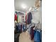 Walk-in closet with plenty of storage for clothes, shoes and other personal items at 11326 Se 175Th Pl, Summerfield, FL 34491