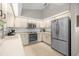 Functional kitchen featuring modern appliances, bright lighting, and ample cabinet space at 11326 Se 175Th Pl, Summerfield, FL 34491