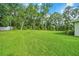 Picturesque backyard with green grass and mature trees at 130 Nw 113Th Cir, Ocala, FL 34482